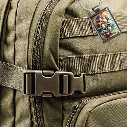 Overlapping Skulls Watercolor Rectangle Metal Keychain