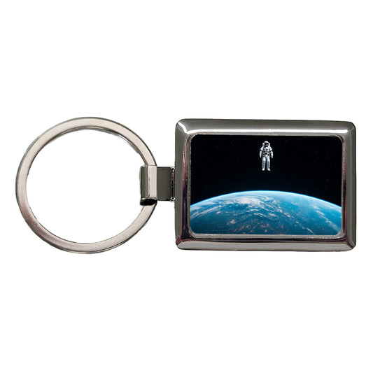Astronaut Drifting In Space Above Earth Rectangle Metal Keychain