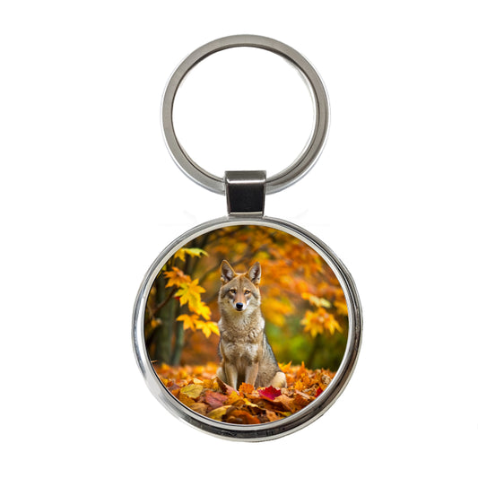 Coyote Sitting In The Fall Leaves Round Metal Keychain