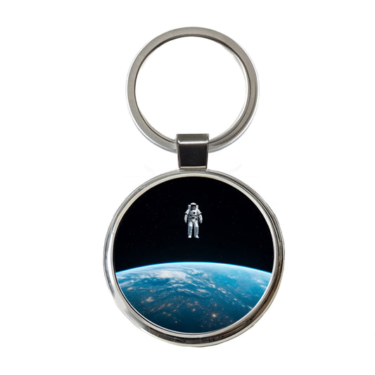 Astronaut Drifting In Space Above Earth Round Metal Keychain