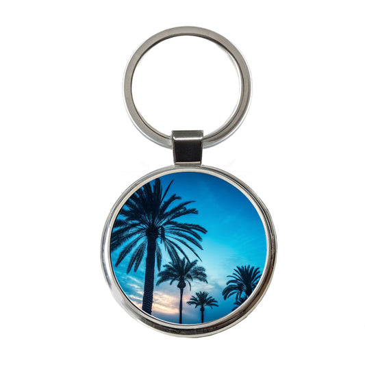 Silhouetted Palm Trees Blue Sky Round Metal Keychain