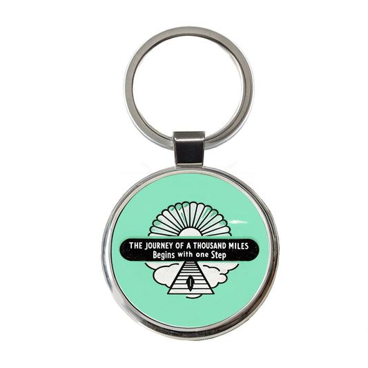 The Journey Of A Thousand Miles Begins With One Step Inspirational Round Metal Keychain