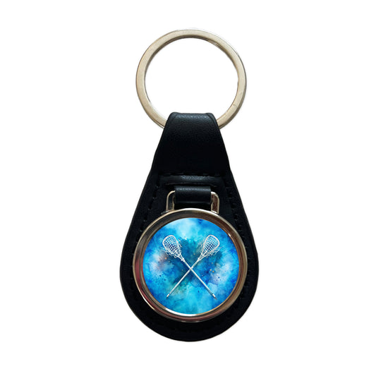 Crossed Lacrosse Sticks On Blue Background Black Leather Metal Keychain