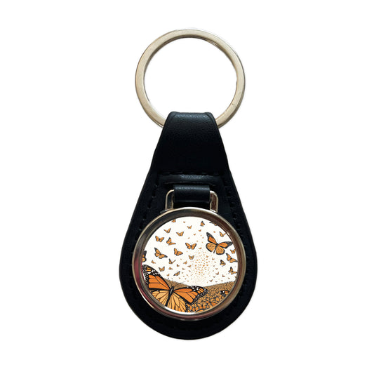 Monarch Butterflies Covering the Countryside Black Leather Metal Keychain