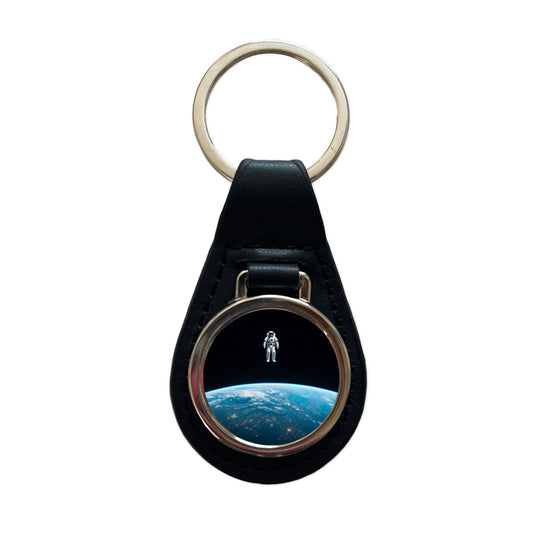 Astronaut Drifting In Space Above Earth Black Leather Metal Keychain