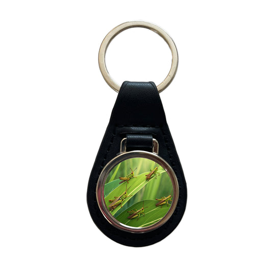 Grasshoppers On Leaves Black Leather Metal Keychain