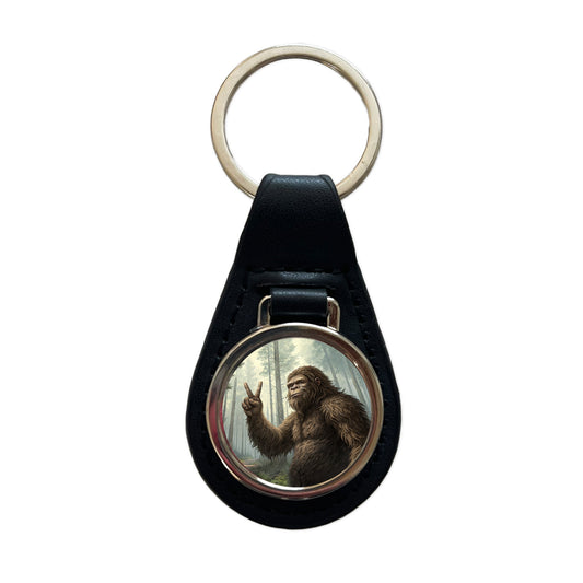 Big Foot Giving The Peace Sign Black Leather Metal Keychain