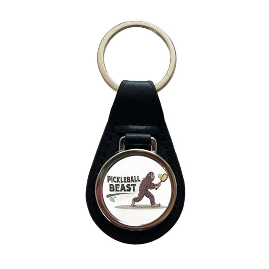 Pickleball Beast Funny Bigfoot Holding Paddle Black Leather Metal Keychain
