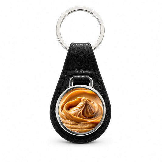 Close-up of Creamy Peanut Butter Black Leather Metal Keychain