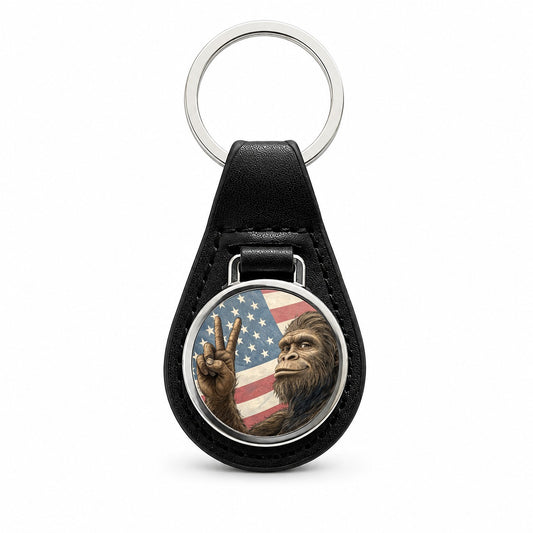 Patriotic Bigfoot Giving The Peace Sign Black Leather Metal Keychain