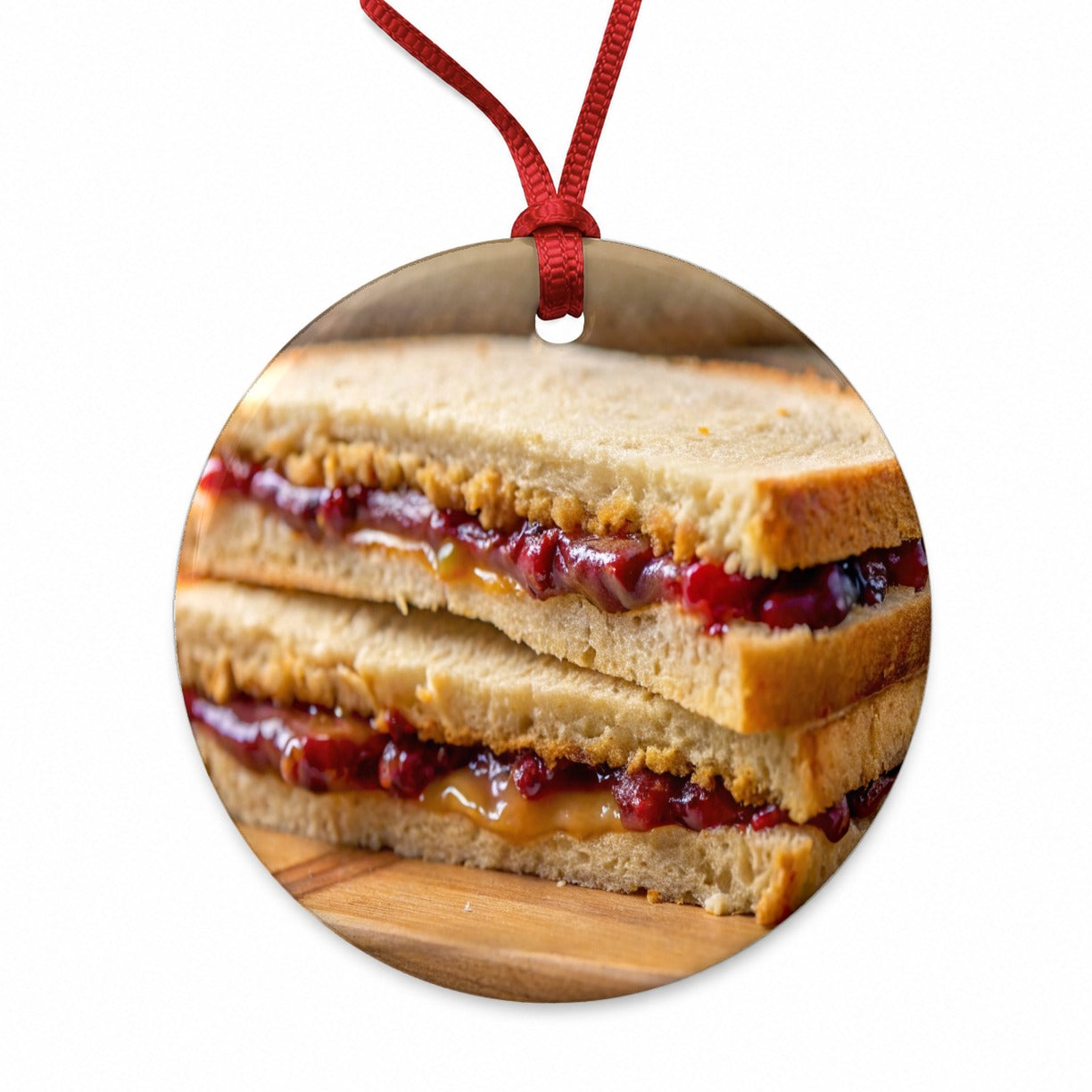 Close-up of a PB&J Peanut Butter And Jelly Sandwich Round Ceramic Holiday Christmas Tree Ornament